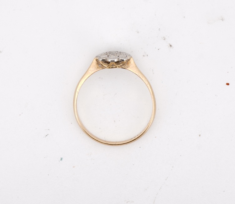 Three rings, comprising: a platinum wedding band, size N1/2, stamped PLAT, gross weight 3 grams; a bicoloured band, size J, stamped PLATINUM 22CT, gross weight 3 grams; and a ring set with a diamond weighing approximatel